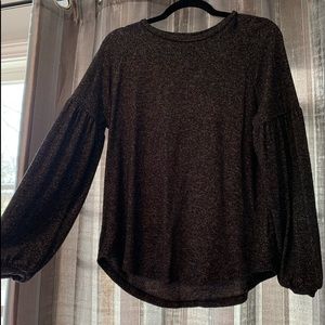 Black top with balloon sleeves.